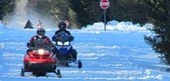 Snowmobiles on winter trail